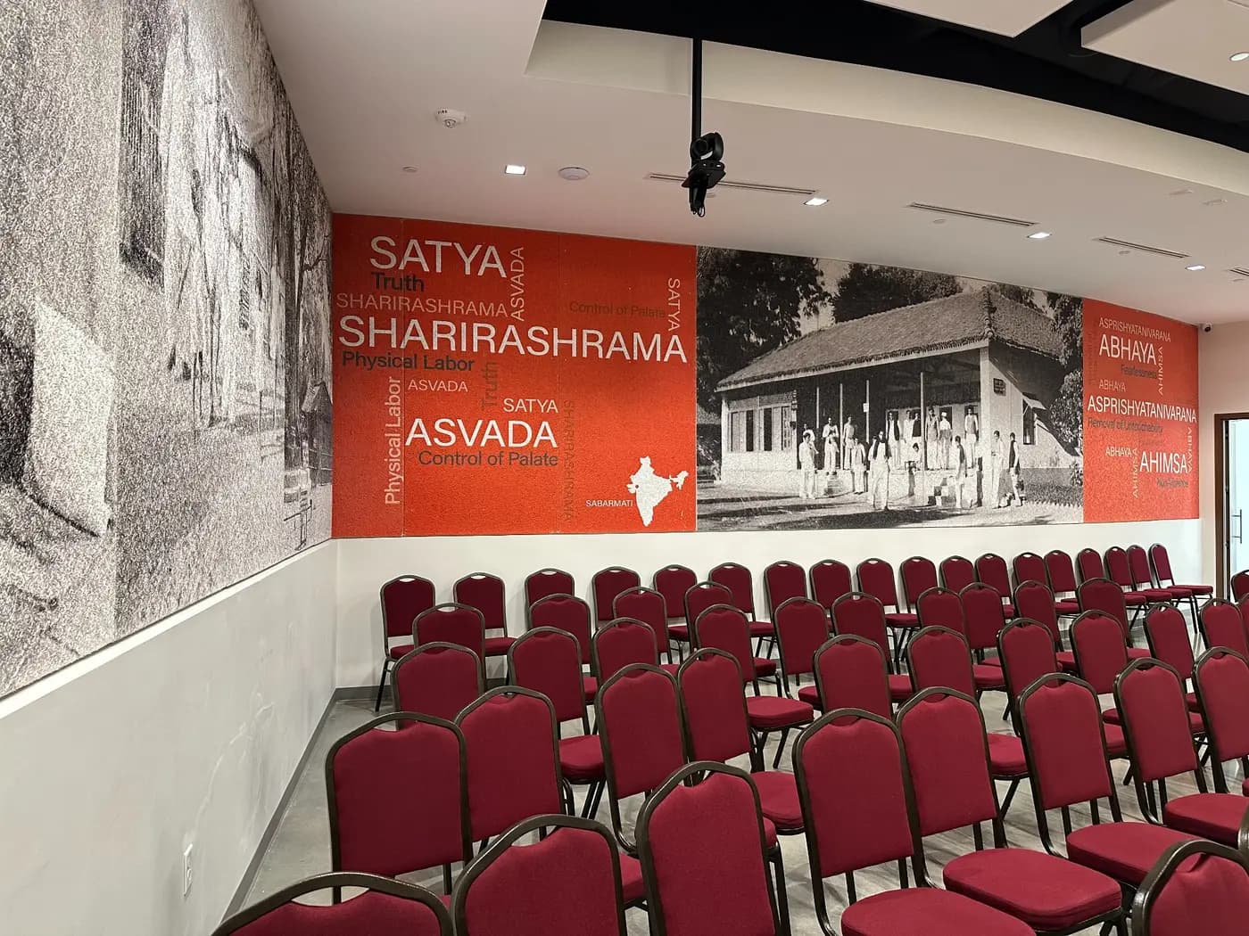Eternal Gandhi Museum auditorium with a mural printed across Tectum acoustic wall panels