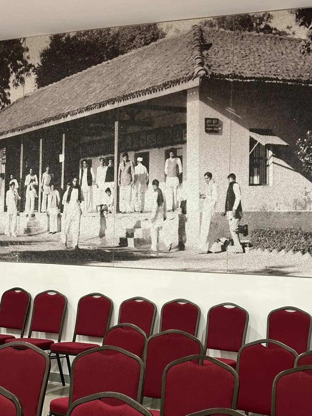Historic Gandhi image printed across Tectum panels behind auditorium seating