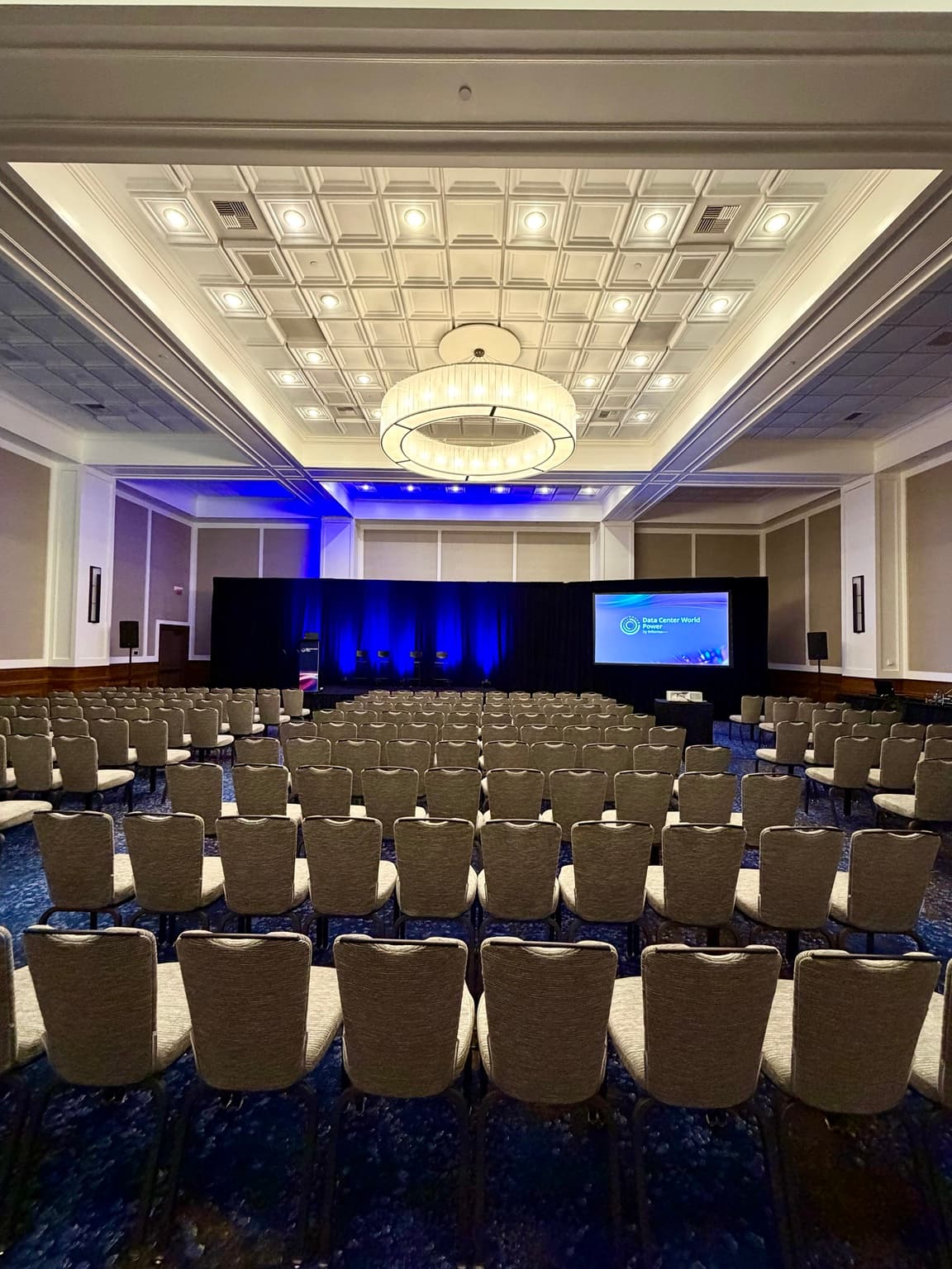 Qwel recessed ceiling tile and chandelier at the Yellow Rose Ballroom