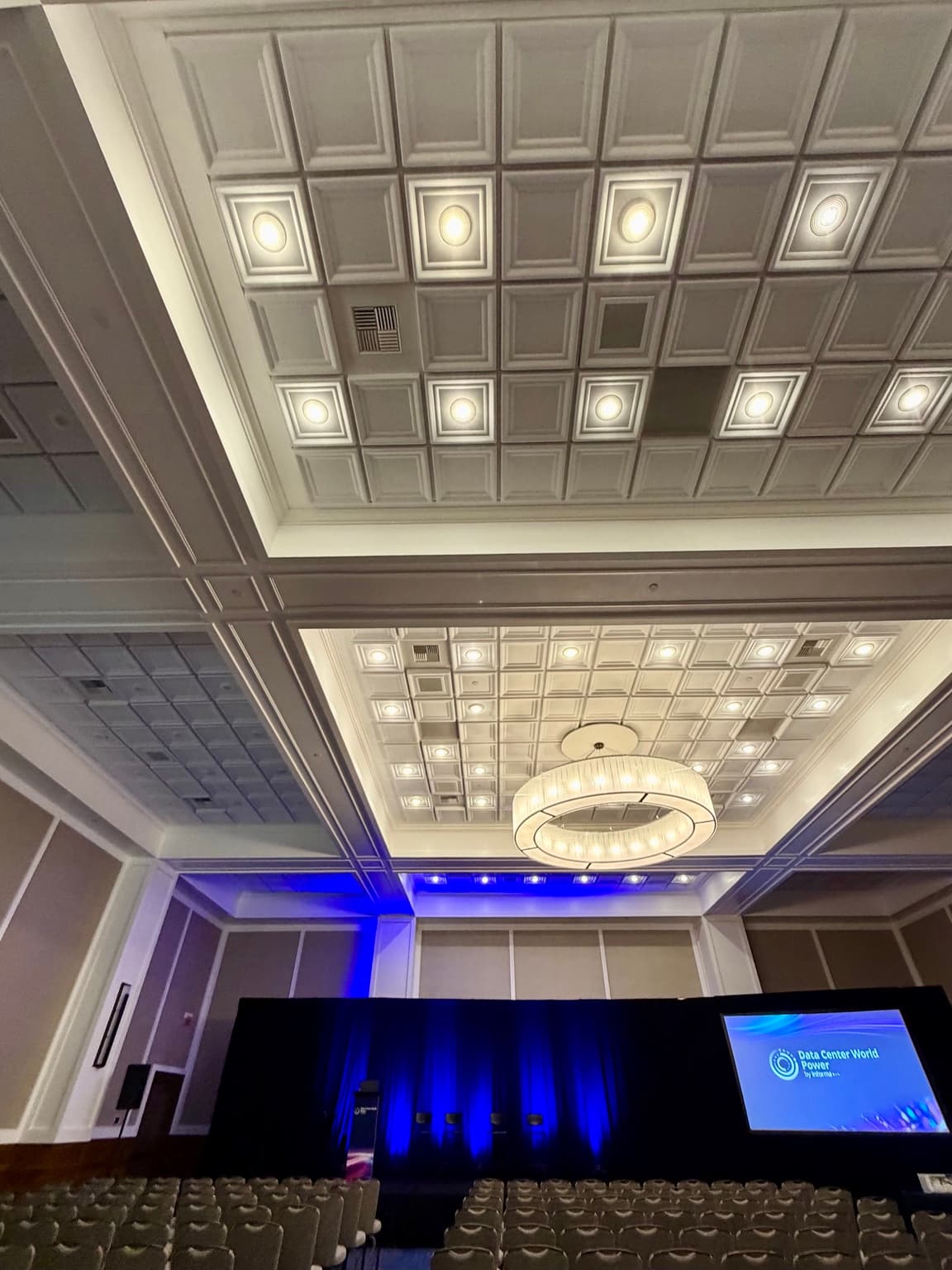 Qwel ceiling tile above the chandelier and ballroom stage